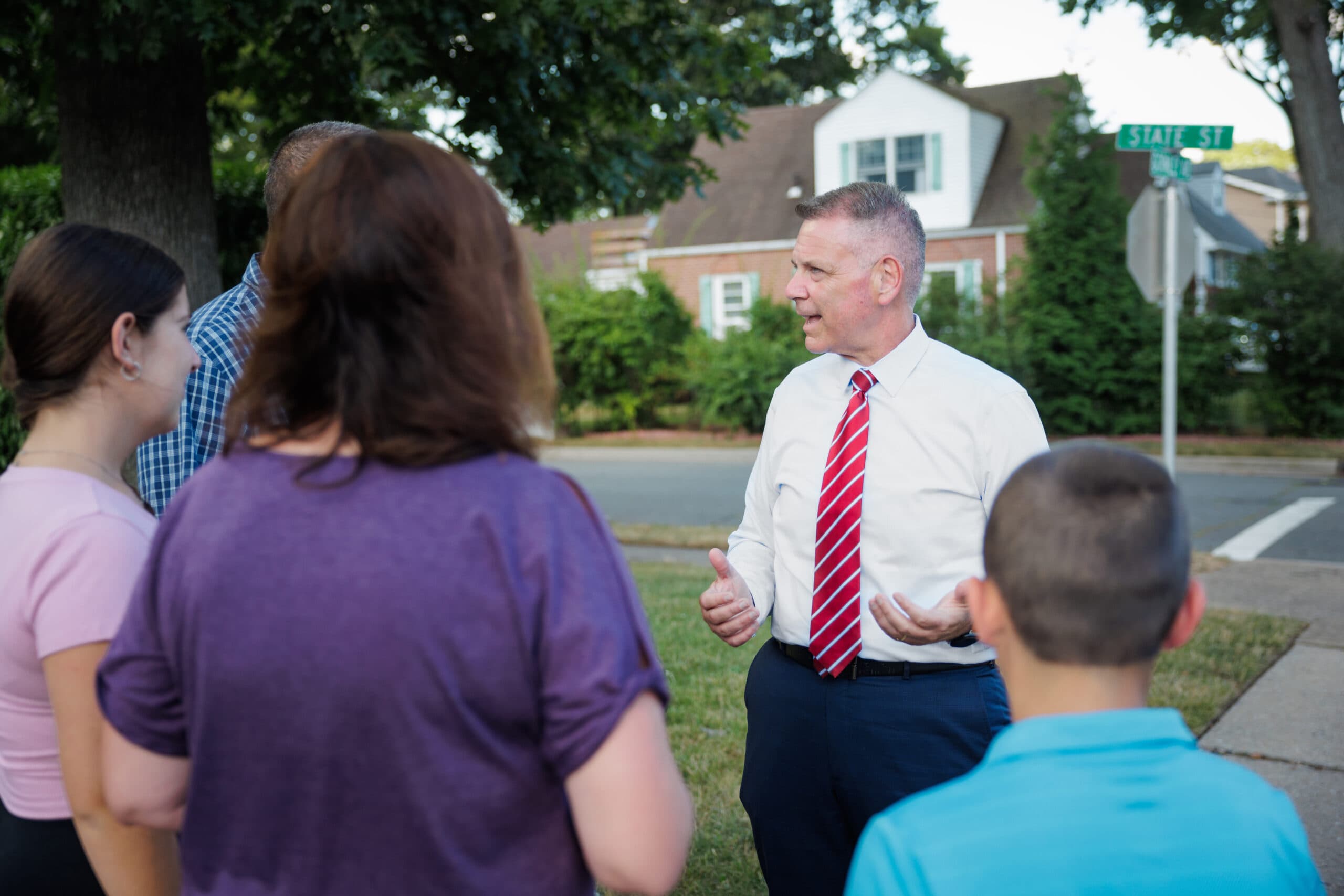 Steve Rhoads talking with residents in their neighborhood